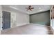 A main bedroom featuring a walk-in closet, tray ceilings, and an ensuite bathroom at 7112 Irongate Dr, Indian Land, SC 29707