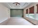 Expansive primary bedroom with tray ceiling and many windows at 7112 Irongate Dr, Indian Land, SC 29707