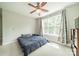 Bright bedroom with large window, modern ceiling fan, and ample natural light at 738 Garden District Dr, Charlotte, NC 28202