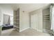 Bedroom featuring neutral walls, double closets, and built in shelves at 738 Garden District Dr, Charlotte, NC 28202