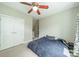 Bedroom featuring neutral walls, double closets, and a ceiling fan at 738 Garden District Dr, Charlotte, NC 28202