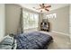 Bedroom with ceiling fan and two large windows at 738 Garden District Dr, Charlotte, NC 28202