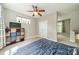 Bright bedroom featuring neutral walls, double closets, and a ceiling fan at 738 Garden District Dr, Charlotte, NC 28202