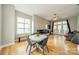 Bright dining area with hardwood floors, modern furnishings, and a large window at 738 Garden District Dr, Charlotte, NC 28202