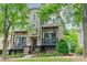 Charming multi-story townhome with inviting front porches and lush landscaping at 738 Garden District Dr, Charlotte, NC 28202