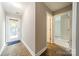 Hallway with exterior access and view into a carpeted room at 738 Garden District Dr, Charlotte, NC 28202