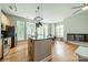 Bright kitchen with large windows, hardwood floors, and stainless appliances at 738 Garden District Dr, Charlotte, NC 28202