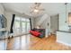 Living room featuring hardwood floors, a comfortable sofa, and balcony access at 738 Garden District Dr, Charlotte, NC 28202