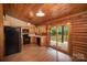 Well-lit kitchen with modern appliances and sliding glass doors to the outdoor patio at 8464 Robinson Church Rd, Charlotte, NC 28215