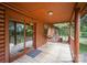 Charming, covered porch with rustic wood railings and plenty of space to unwind and entertain at 8464 Robinson Church Rd, Charlotte, NC 28215
