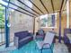 Relaxing back patio with comfortable seating, a shade awning, and a view of the backyard at 907 Edgewood Cir, Gastonia, NC 28052