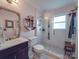 Stylish bathroom with a walk-in glass shower, classic vanity, and modern fixtures at 907 Edgewood Cir, Gastonia, NC 28052