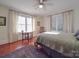 Inviting bedroom featuring hardwood floors, a ceiling fan, and an abundance of natural light at 907 Edgewood Cir, Gastonia, NC 28052