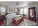 Bright bedroom with a ceiling fan, ample natural light, and hardwood floors, complete with a decorative rug at 907 Edgewood Cir, Gastonia, NC 28052
