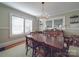Elegant dining room features a crystal chandelier, classic wainscoting, and multiple windows at 907 Edgewood Cir, Gastonia, NC 28052