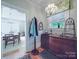 Entryway has a decorative console table with curated decor, plus a view of the dining room at 907 Edgewood Cir, Gastonia, NC 28052