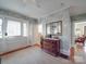 Bright entryway with swan wallpaper, a chest of drawers, and a view to the living room at 907 Edgewood Cir, Gastonia, NC 28052