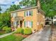Classic two-story brick home with green shutters and a private balcony, set on a lush lot at 907 Edgewood Cir, Gastonia, NC 28052