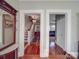 Elegant foyer with hardwood floors, staircase, and views into adjoining rooms at 907 Edgewood Cir, Gastonia, NC 28052