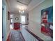 Bright hallway with hardwood floors, complemented by a patterned rug and framed artwork, leading to other rooms at 907 Edgewood Cir, Gastonia, NC 28052