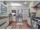 Renovated kitchen features stainless steel appliances, granite countertops, and updated white cabinets at 907 Edgewood Cir, Gastonia, NC 28052