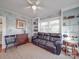 Comfortable living room with built-in shelving, natural light, and a stylish black leather sofa at 907 Edgewood Cir, Gastonia, NC 28052