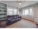 Cozy living room with built-in shelving, decorative wallpaper, and ample natural light at 907 Edgewood Cir, Gastonia, NC 28052