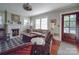 Cozy living room featuring a fireplace, large windows, and comfortable seating at 907 Edgewood Cir, Gastonia, NC 28052