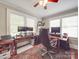 Bright home office space with multiple windows, dual monitors, and ample desk space for productivity at 907 Edgewood Cir, Gastonia, NC 28052