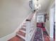 Stairway showcasing hardwood steps and vintage light fixture at 907 Edgewood Cir, Gastonia, NC 28052