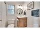 Charming bathroom features new vanity, natural light, and modern fixtures at 9217 Tenby Ln, Matthews, NC 28104