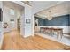 Open-concept home with hardwood floors, a staircase, and a dining room with wainscoting at 9217 Tenby Ln, Matthews, NC 28104