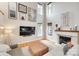 Bright living room features a fireplace, large windows, and high ceilings at 9217 Tenby Ln, Matthews, NC 28104