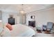 Neutral-toned main bedroom with tray ceiling, plush carpeting, and a ceiling fan at 9217 Tenby Ln, Matthews, NC 28104