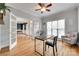 Stylish office with hardwood floors, glass doors, and a comfortable seating area at 9217 Tenby Ln, Matthews, NC 28104
