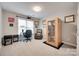 Well-lit office space with desk, chair, and a personal sauna for relaxation and wellness at 9217 Tenby Ln, Matthews, NC 28104