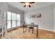 Bright office space with hardwood floors, a large window, and neutral wall color at 9217 Tenby Ln, Matthews, NC 28104