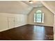 Spacious bedroom with unique architectural features and a large arched window at 9907 Furlong Trl, Charlotte, NC 28269