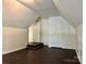 Bedroom featuring hard wood floors, vaulted ceilings, and multiple doorways at 9907 Furlong Trl, Charlotte, NC 28269