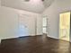 Bedroom featuring hard wood floors, large closet, and neutral paint at 9907 Furlong Trl, Charlotte, NC 28269