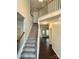 Grand entryway showcases hardwood floors, a staircase, and natural light at 9907 Furlong Trl, Charlotte, NC 28269