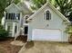 Charming two-story house features a convenient two-car garage and welcoming front entrance at 9907 Furlong Trl, Charlotte, NC 28269
