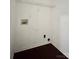 A laundry room with a wire shelf and hookups at 9907 Furlong Trl, Charlotte, NC 28269