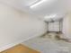 Bright and spacious two car garage featuring an electric roll-up garage door and painted walls at 100 N Laurel Ave # 107, Charlotte, NC 28207