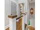 Hallway with hardwood floors, white trim, and modern lighting fixture at 100 N Laurel Ave # 107, Charlotte, NC 28207