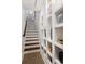 Hallway with staircase and built-in shelving, enhancing the home's appeal at 100 N Laurel Ave # 107, Charlotte, NC 28207