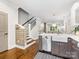 Beautiful kitchen featuring stainless steel appliances, hardwood floors, and bar-style seating area at 100 N Laurel Ave # 107, Charlotte, NC 28207