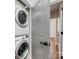 Laundry area with stacked washer and dryer in a bright, well-lit space at 100 N Laurel Ave # 107, Charlotte, NC 28207