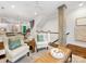 Bright open-concept living room featuring modern decor and hardwood floors at 100 N Laurel Ave # 107, Charlotte, NC 28207