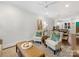 Inviting living room with modern ceiling fan, stylish decor, and comfortable seating arrangement at 100 N Laurel Ave # 107, Charlotte, NC 28207